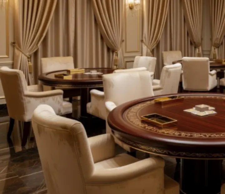 Signature card lounge setup with custom poker tables and ambient lighting at Thejes Tertable.